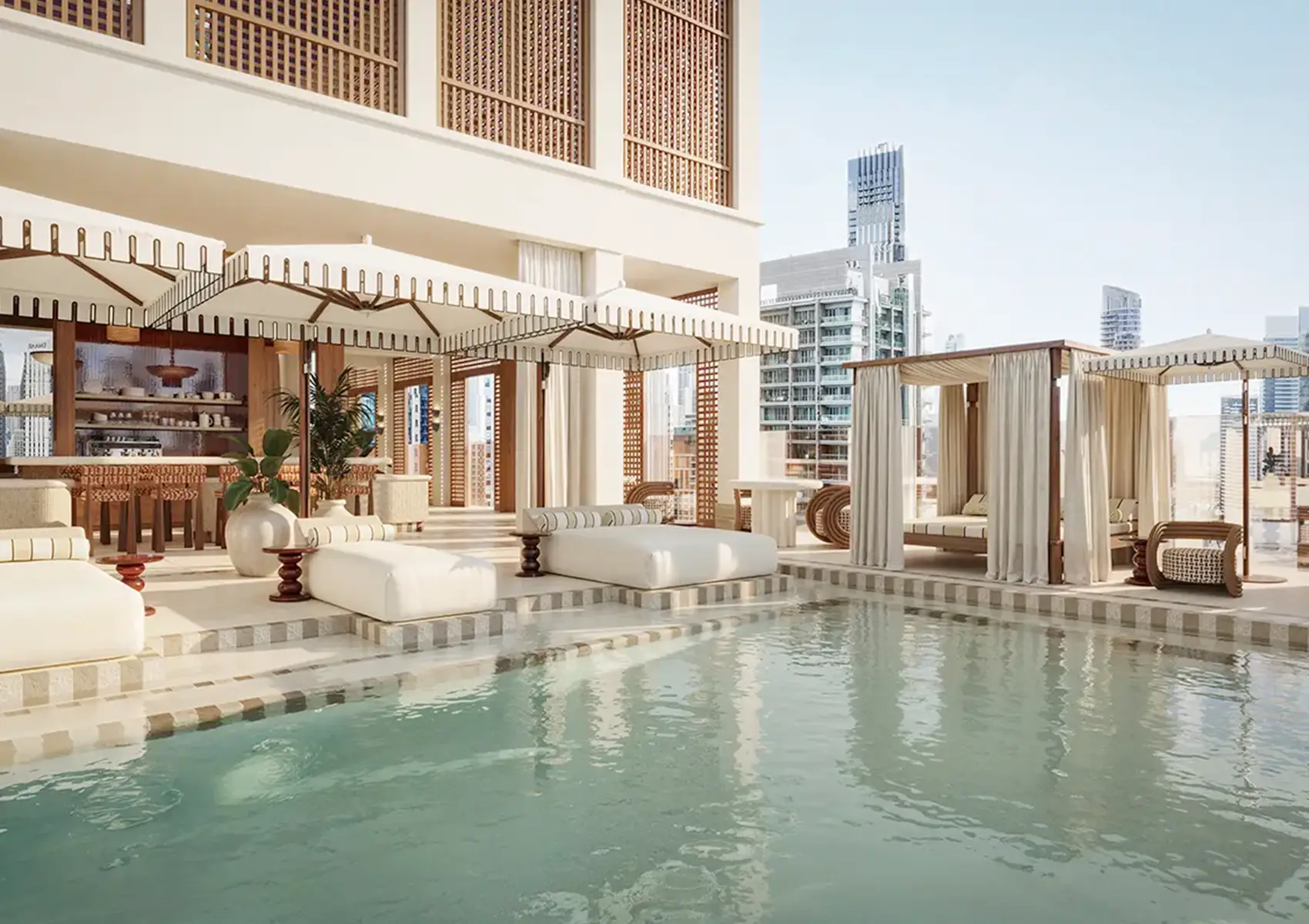 ELIRE rooftop pool bar with lounge seating and ambient lighting